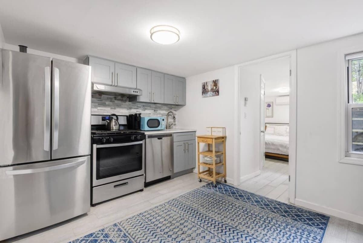 Renovated kitchen with brand new appliances (fridge, dishwasher, stove). Stocked with all cooking essentials.